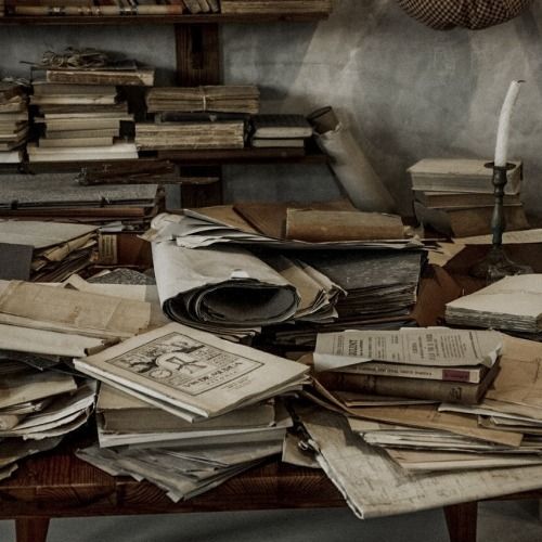 cluttered books on table